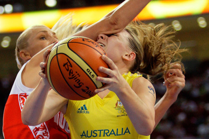 Australia's Penny Taylor, right, is fouled by Russia's Maria Stepanova during their women's basketball preliminary game at the Beijing 2008 Olympics in Beijing, Sunday, Aug, 17, 2008. (AP Photo/Dusan Vranic)